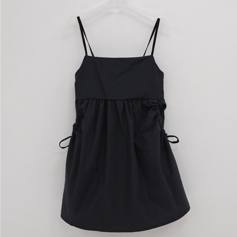 Black spaghetti strap dress with shirred pockets